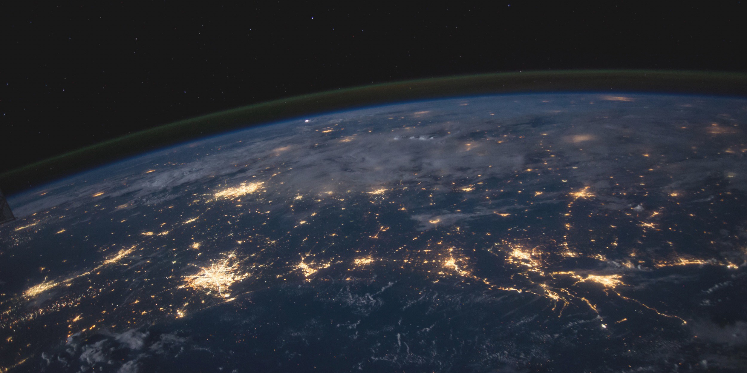 An outer-space view of the Earth showing electronic communications networks
